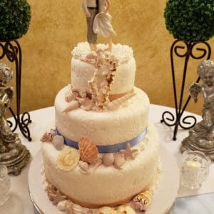 Rustic romantic seashells wedding cake by Beach Weddings Alabama