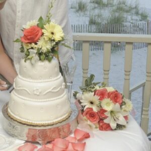 3 tier coral wedding cake at the beach by Beach Weddings Alabama call 866-207-9447