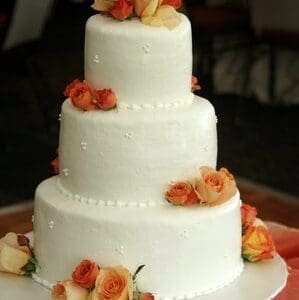 Coral n orange wedding cake by Beach Weddings Alabama