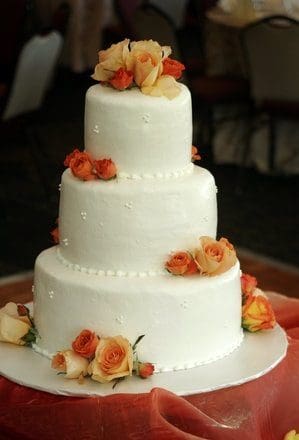 Coral n orange wedding cake by Beach Weddings Alabama