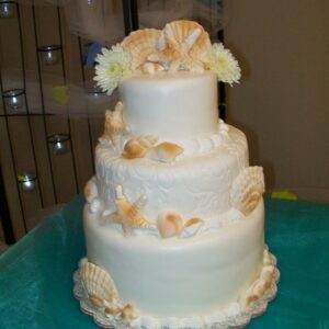 Seashells and flowers wedding cake by Beach Weddings Alabama